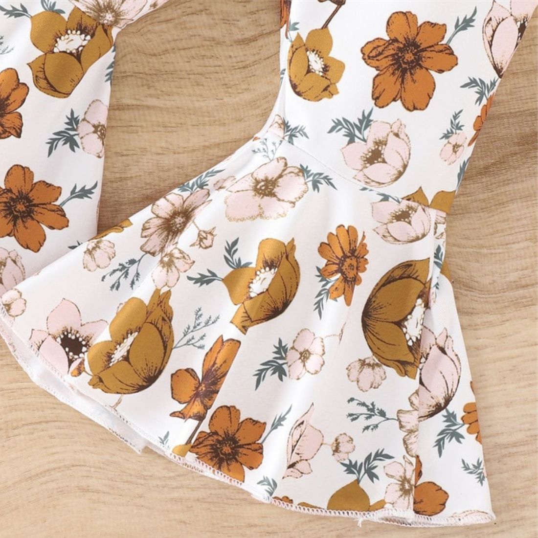 Close up of Autumn Floral Flares Baby Clothing Set