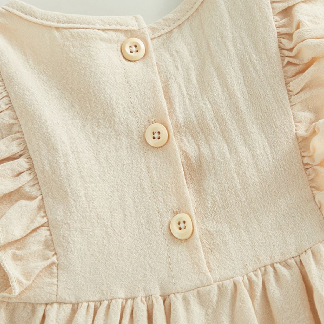 Close up of Ruffle Casual Toddler Dress back buttons